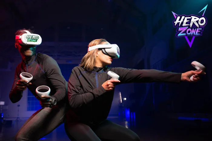 A man and woman in VR gear posing.