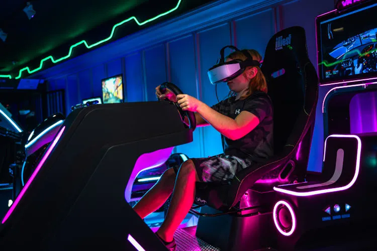 Boy in the VR car racing machine